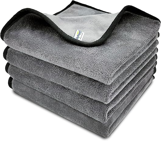 a stack of grey blankets